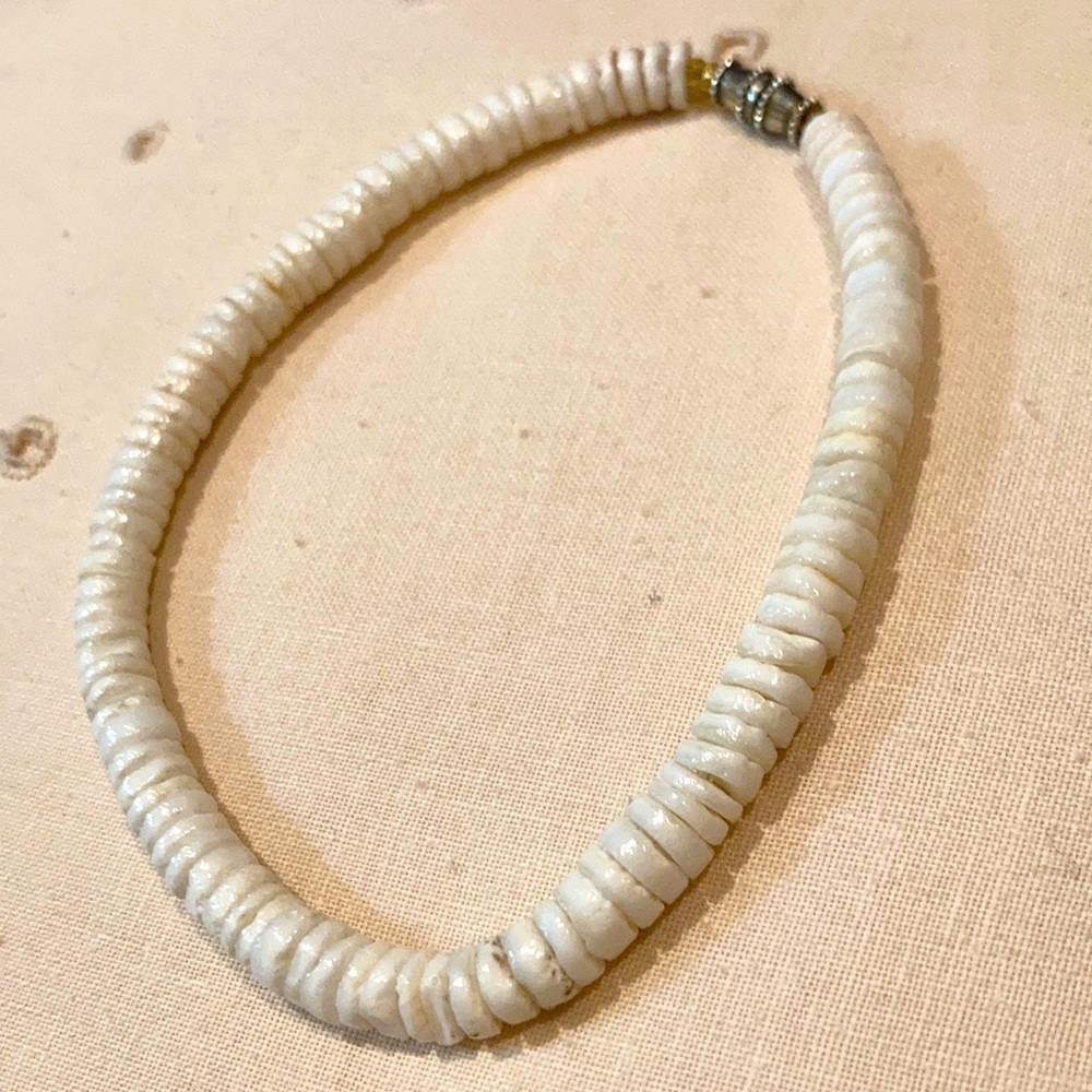 Handmade shell bracelet with secure twist closure.   9” in length. Lovely piece!